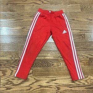 Adidas Red Sweatpants with White Stripes and Tapered Fit